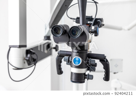 Modern dental microscope for operations in surgery room at hospital 92404211