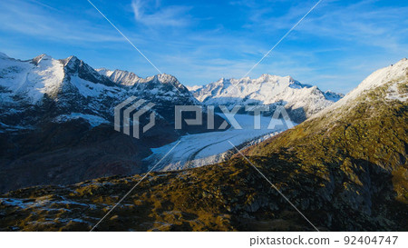 Aerial view over the largest glacier in Europe - the Aletschgletscher in the Swiss Alps 92404747