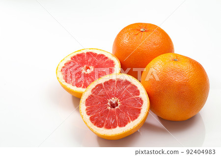 Grapefruit _ ruby sliced into white background Grapefruit _ ruby sliced into white background 92404983