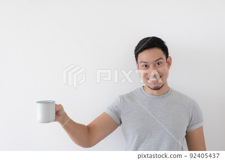Happy man drink healthy water from white cup isolated on white background. 92405437