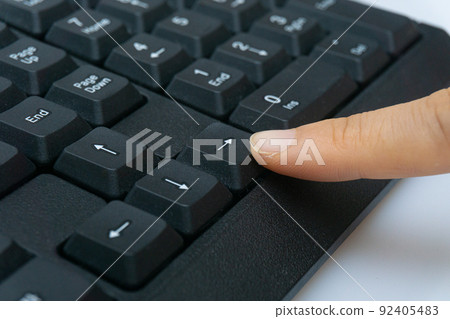 hand pressing computer keyboard hand pressing computer keyboard 92405483