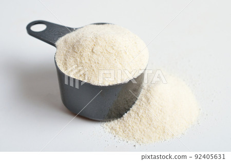 Guar gum, also called guaran, is a galactomannan polysaccharide extracted from guar beans. On white background. 92405631