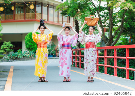 A woman and a friend in a yukata enjoying a hot spring trip A woman and a friend in a yukata enjoying a hot spring trip 92405942