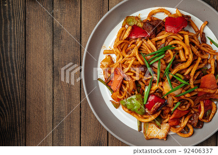 Portion of oriental dish tsomyan roasted noodles Portion of oriental dish tsomyan roasted noodles 92406337