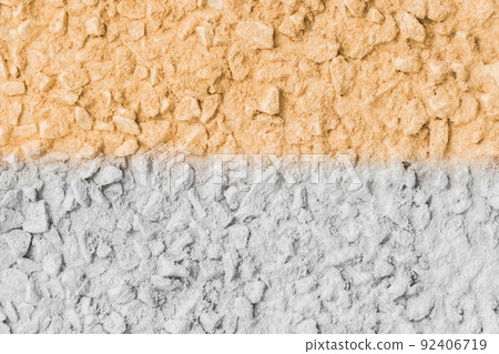 Stone surface painted in two colors white and yellow or orange abstract wall texture background design Stone surface painted in two colors white and yellow or orange abstract wall texture background design 92406719