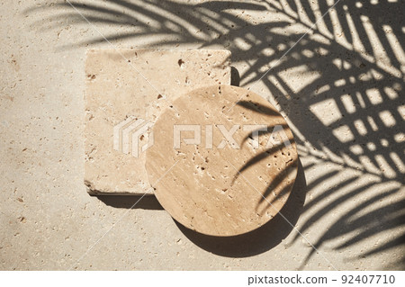 Travertine stone display flat lay podium on travertine stone background and palm shadow. Product promotion Beauty cosmetic showcase. 92407710