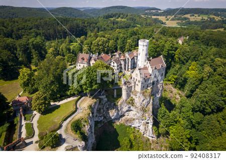 Lichtenstein castle on forested rock cliff in Swabian Alps in summer 92408317
