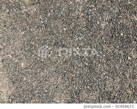 Texture of pebbles, gravel, urban road surface, soil surface.  92408623
