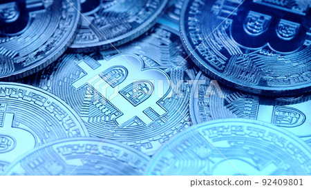 Bitcoin, crypto currency. Blue coins rotating clockwise. Digital exchange, popularity of BTC, symbol 92409801