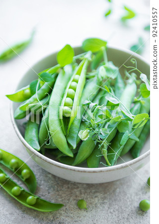 Bowl with sweet pea pods Bowl with sweet pea pods 92410557