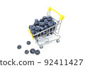 small shopping cart full of fresh blueberry isolated. selective focus 92411427