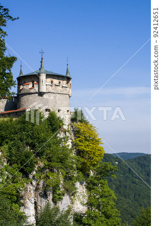 Lichtenstein castle on forested rock cliff in Swabian Alps in summer Lichtenstein castle on forested rock cliff in Swabian Alps in summer 92412651