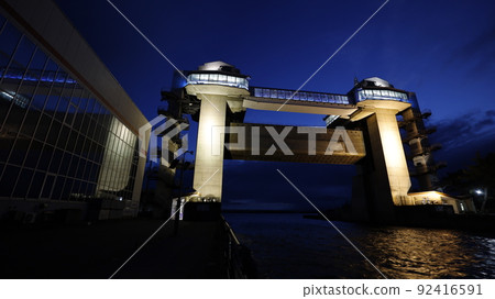 Large observatory sluice gate "Byuo" lit up in the color of the Ukrainian flag in protest of Russia's military invasion of Ukraine 92416591