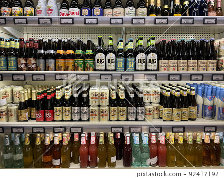 Large selection of low-alcohol drinks and beer on the shelves in the supermarket Large selection of low-alcohol drinks and beer on the shelves in the supermarket 92417192