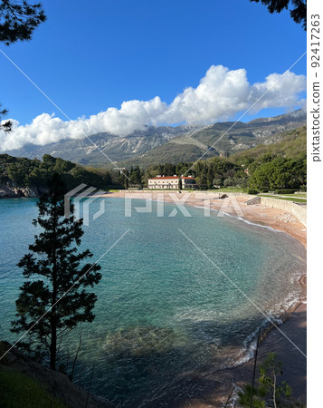 Villa Milocer on the beach with mountains in the background Villa Milocer on the beach with mountains in the background 92417263