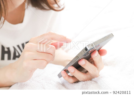 Hands to touch the smartphone Hands to touch the smartphone 92420811