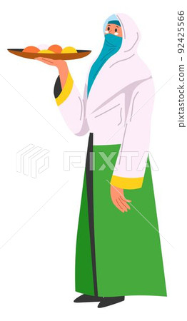 Woman in hijab serving dessert or fruits on tray Woman in hijab serving dessert or fruits on tray 92425566