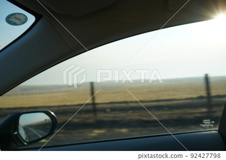 Driving a meadow in California 92427798