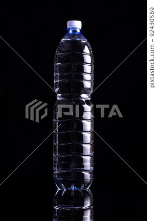 Plastic bottle of water on black background. Plastic bottle of water on black background. 92430569