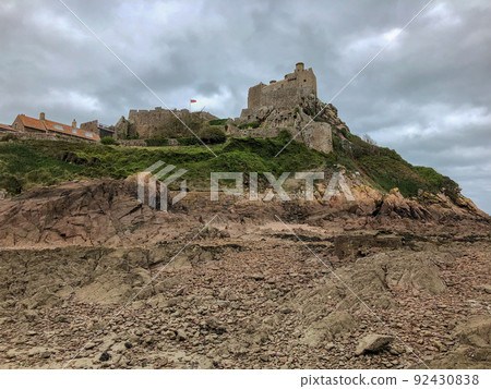 Mont Orgueil Castle, a tourist attraction on Jersey under a cloudy sky 92430838