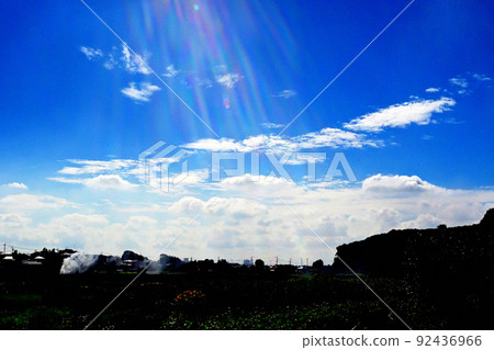Blue sky, backlight, flare and rural scenery 92436966