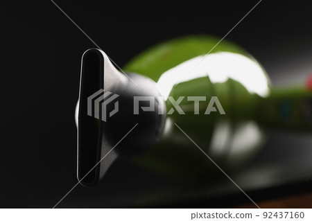 Green professional hairdryer device with nozzle on black background, tool for hair master Green professional hairdryer device with nozzle on black background, tool for hair master 92437160