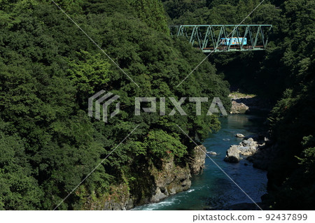 Tarumi Railway crossing the Neo River 92437899
