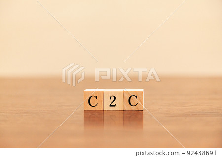 Transactions between individuals. C2C. C2C letters drawn on a wooden block 92438691