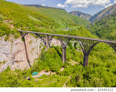 Montenegro. Dzhurdzhevich Bridge Over The River Tara Portrait of a disgruntled girl sitting at a cafe table 92440122