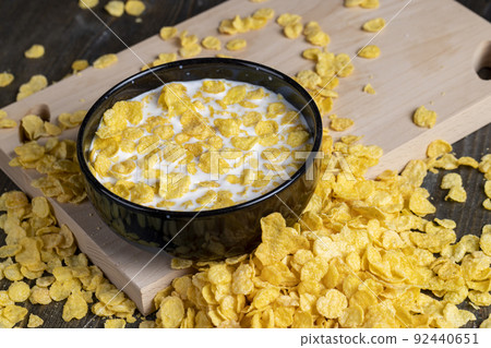 dry breakfast corn flakes of yellow color , close up dry breakfast corn flakes of yellow color , close up 92440651