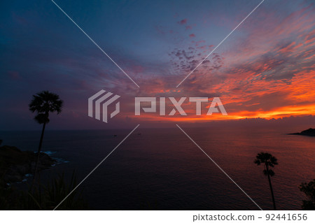 Colourful sunset sky on seashore beach wave Phuket 92441656