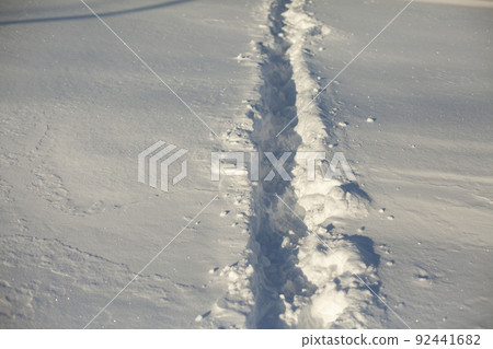 Path in snow. Path through deep snow. Path in snow. Path through deep snow. 92441682