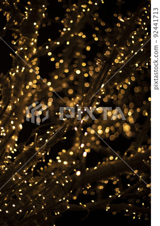 Garlands shot in blur. Backdrop of lights in dark. Lot of light bulbs are lit at festival. 92441713