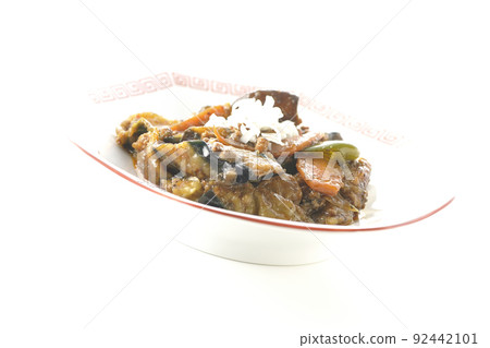 Photographed Mao Eggplant on an octagonal Chinese plate on a white background 92442101