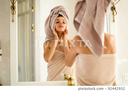 Girl takes care of her beauty and health of her skin. 92442932