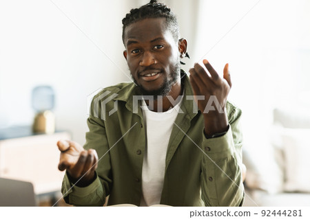 Black man making video call, having virtual online meeting and emotional conversation, gesturing to camera 92444281