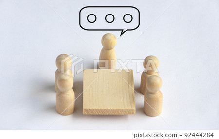 Wooden people figures having business meeting. Business meeting concept 92444284