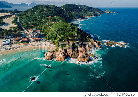 Touristic beach with rocks and Atlantic ocean with waves in Brazil. Aerial view Touristic beach with rocks and Atlantic ocean with waves in Brazil. Aerial view 92446189