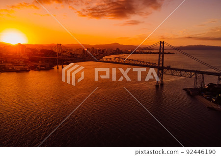 Aerial view of Hercilio luz cable bridge with sunset in Florianopolis, Brazil Aerial view of Hercilio luz cable bridge with sunset in Florianopolis, Brazil 92446190