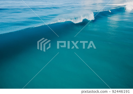 Blue perfect wave in tropical ocean. Breaking barrel wave. Aerial drone view 92446191