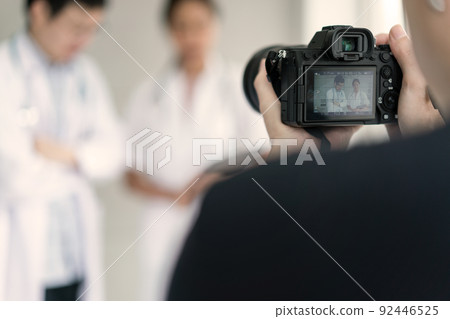 Photographer taking footage on the concept of doctors and nurses for sale on the website 92446525