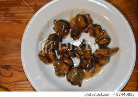 Meat of sea rapans in sauce 92449883