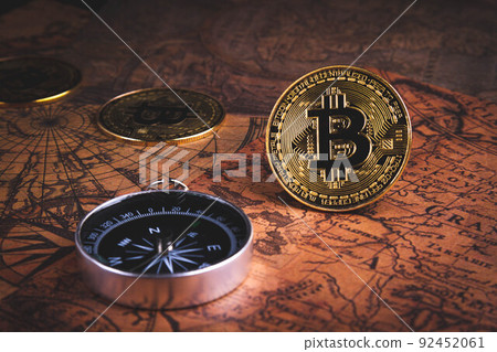 Compass and bitcoin. Travel and cryptocurrencies. Buying tickets with bitcoins. 92452061