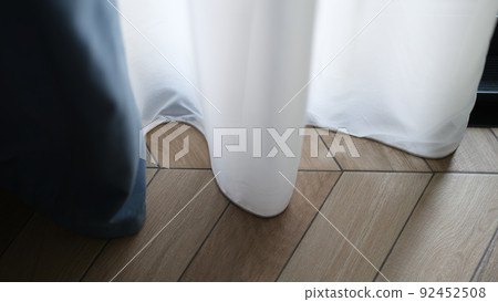 Beautiful white curtains indoors and wooden parquet floor closeup 92452508