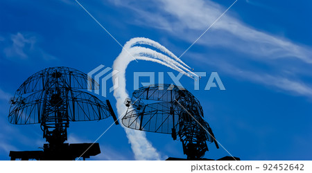 Air defense raiders of military mobile anti-aircraft complexes (radar is designed and automatic tracking of targets and missiles) against the background of the flight of modern combat fighters,Russia Air defense raiders of military mobile anti-aircraft complexes (radar is designed and automatic tracking of targets and missiles) against the background of the flight of modern combat fighters,Russia 92452642