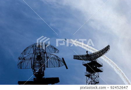 Air defense raiders of military mobile anti-aircraft complexes (radar is designed  and automatic tracking of targets and missiles) against the background of the flight of modern combat fighters,Russia 92452647
