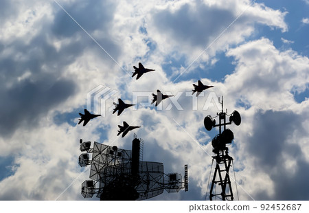 Air defense raiders of military mobile anti-aircraft complexes (radar is designed  and automatic tracking of targets and missiles) against the background of the flight of modern combat fighters,Russia 92452687