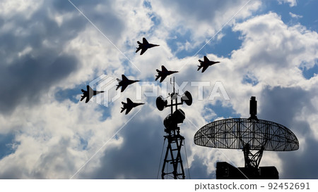 Air defense raiders of military mobile anti-aircraft complexes (radar is designed  and automatic tracking of targets and missiles) against the background of the flight of modern combat fighters,Russia 92452691