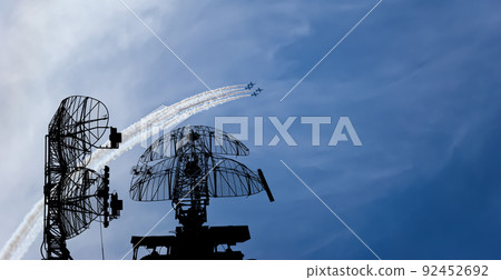 Air defense raiders of military mobile anti-aircraft complexes (radar is designed  and automatic tracking of targets and missiles) against the background of the flight of modern combat fighters,Russia 92452692