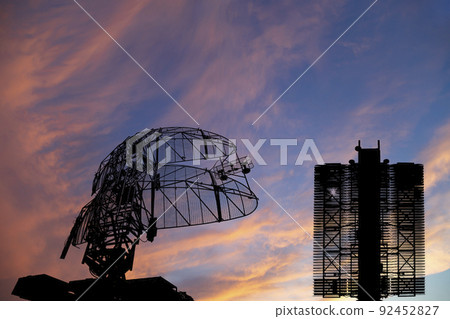 Air defense radars of military mobile anti aircraft systems (radar is designed  and automatic tracking of targets and missiles) , on the background of the sunset orange sky, Russia 92452827